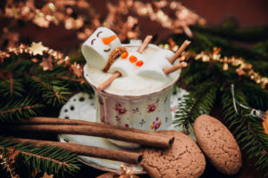Christmas happy marshmallow man in a cup of coffee